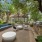 Outdoor lounge space with blue cushioned chairs