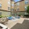 Outdoor lounge space with blue cushioned chairs