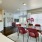 Furnished dining room next to the apartment living area inside a home at Alto Highland Park
