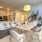 Apartment dining area flooded with natural light and access to the kitchen at Alto Highland Park