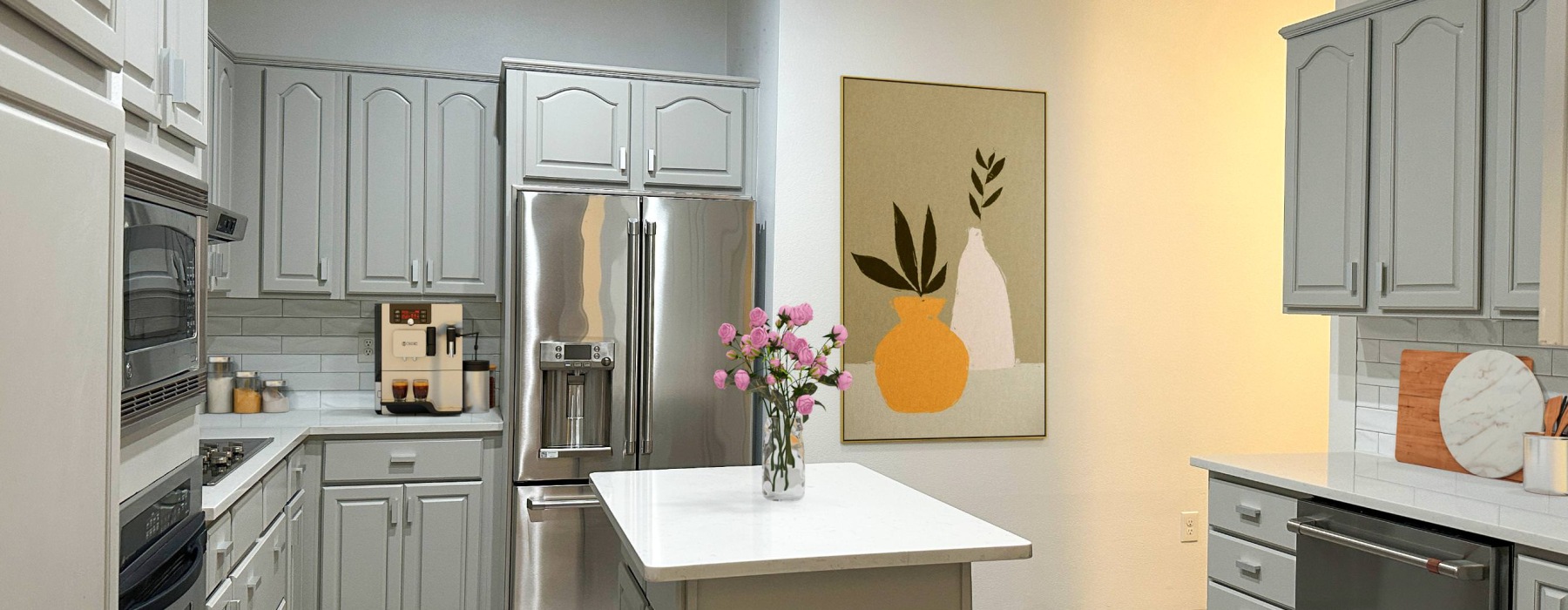 Stainless steel appliances inside a modern apartment home at Alto Highland Park