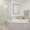 Spacious well-lit bathroom with large shower