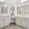 Spacious well-lit bathroom with large vanity
