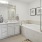 Spacious well-lit bathroom with large vanity