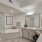 a bathroom with a tub sink and a toilet