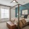 a bedroom with a bed and a fan